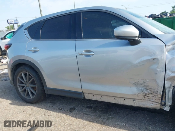 2020 Mazda CX-5 Grand Touring with VIN JM3KFADM5L0739306, listed as a IAAI auction lot 42215667 with 126,100 mi miles and . Bid and sale history available at DreamBid. Image 13.