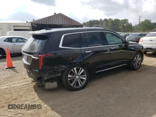 2020 Cadillac XT6 FWD Premium Luxury with VIN 1GYKPCRS6LZ102682, listed as a Copart auction lot 56906645 with 76,884 mi miles and Salvage title. Bid and sale history available at DreamBid. Image 3.