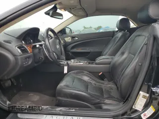 2010 Jaguar XK with VIN SAJWA4GBXALB36341, listed as a Copart auction lot 68307584 with 76,951 mi miles and Salvage Title. Bid and sale history available at carsss.com. Image 7.