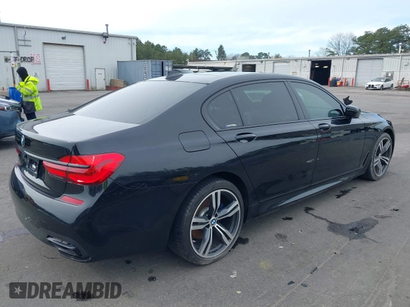 2019 BMW 7 Series 740i with VIN WBA7E2C57KB217973, listed as a IAAI auction lot 39064321 with 54,818 mi miles and . Bid and sale history available at DreamBid. Image 4.