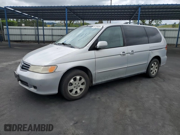 2002 Honda Odyssey EX-L with VIN 2HKRL18902H506828, listed as a Copart auction lot 53735625 with 214,446 mi miles and Salvage title. Bid and sale history available at DreamBid. Image 1.