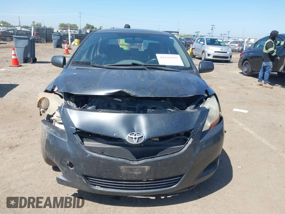 2009 Toyota Yaris with VIN JTDBT903891349784, listed as a IAAI auction lot 42135557 with 244,107 mi miles. Bid and sale history available at carsss.com. Image 6.