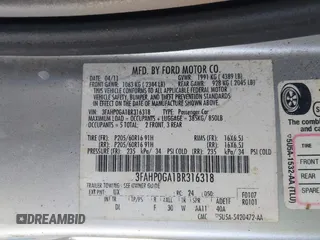 2011 Ford Fusion S with VIN 3FAHP0GA1BR316318, listed as a IAAI auction lot 41824086 with 122,229 mi miles. Bid and sale history available at carsss.com. Image 9.