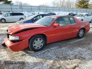 2002 Cadillac Eldorado z VIN 1G6EC12972B106132, wystawiony jako Copart lot #86799624 z przebiegiem 75 334 mil mil oraz Szkody całkowita. Historia ofert i sprzedaży dostępna na DreamBid. Obrazek 1.