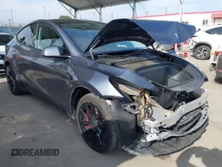 2023 Tesla Model Y Long Range with VIN 7SAYGAEE2PF851031, listed as a IAAI auction lot 42039393 with 21,398 mi miles. Bid and sale history available at carsss.com. Image 1.