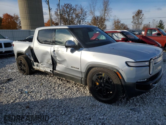 2023 Rivian R1T Adventure with VIN 7FCTGAAA2PN017170, listed as a Copart auction lot 77473014 with 28,821 mi miles and Salvage Title. Bid and sale history available at DreamBid. Image 4.