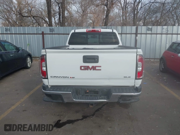 2019 GMC Canyon 4WD SLE z VIN 1GTG6CEN5K1297945, wystawiony jako IAAI lot #41308105 z przebiegiem 93 226 mil mil oraz . Historia ofert i sprzedaży dostępna na DreamBid. Obrazek 16.
