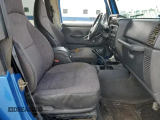 2002 Jeep Wrangler Sport with VIN 1J4FA49S32P762794, listed as a Copart auction lot 52132955 with 243,499 mi miles and Salvage Title. Bid and sale history available at carsss.com. Image 7.