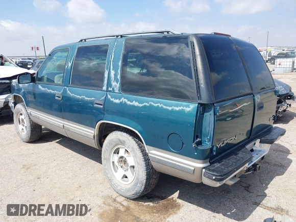 1998 GMC Yukon z VIN 1GKEK13R3WJ715863, wystawiony jako IAAI lot #42410130 z przebiegiem 154 139 mil mil oraz . Historia ofert i sprzedaży dostępna na DreamBid. Obrazek 3.