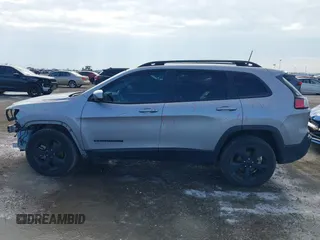 2021 Jeep Cherokee Altitude with VIN 1C4PJLLB6MD112830, listed as a IAAI auction lot 41560135 with 76,760 mi miles. Bid and sale history available at carsss.com. Image 15.