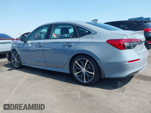 2023 Honda Civic Touring with VIN 2HGFE1F92PH322377, listed as a IAAI auction lot 42361473 with 43,533 mi miles and . Bid and sale history available at DreamBid. Image 13.