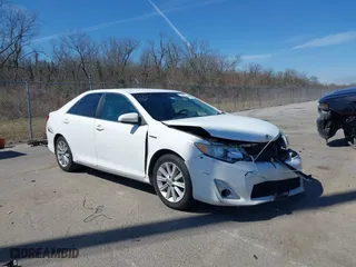 2014 Toyota Camry Hybrid LE with VIN 4T1BD1FK2EU127016, listed as a IAAI auction lot 41683491 with 173,227 mi miles. Bid and sale history available at carsss.com. Image 1.