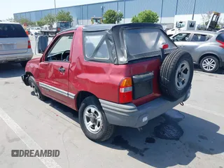 1999 Chevrolet Tracker z VIN 2CNBJ1865X6935435, wystawiony jako IAAI lot #42421108 z przebiegiem Nie podano mil oraz . Historia ofert i sprzedaży dostępna na DreamBid. Obrazek 3.