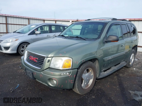 2003 GMC Envoy SLT with VIN 1GKDT13SX32161898, listed as a IAAI auction lot 41642072 with 230,154 mi miles. Bid and sale history available at carsss.com. Image 2.