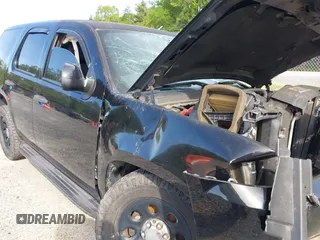 2013 Chevrolet Tahoe Commercial with VIN 1GNLC2E00DR265941, listed as a IAAI auction lot 42289977 with 206,840 mi miles and . Bid and sale history available at DreamBid. Image 16.