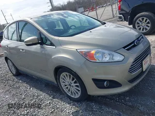 2016 Ford C-Max Energi SEL with VIN 1FADP5CU2GL113164, listed as a IAAI auction lot 41597104 with 127,008 mi miles. Bid and sale history available at carsss.com. Image 1.