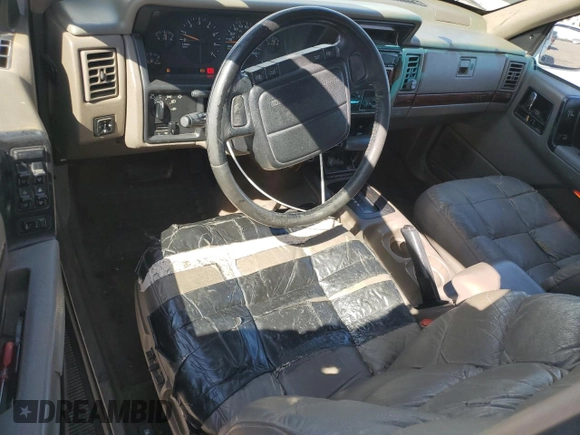 1995 Jeep Grand Cherokee Limited with VIN 1J4GZ78Y3SC701103, listed as a Copart auction lot 72038184 with 143,829 mi miles and Salvage Title. Bid and sale history available at carsss.com. Image 8.