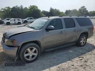 2007 Chevrolet Suburban LTZ z VIN 1GNFC16097R249683, wystawiony jako Copart lot #59217785 z przebiegiem Nie podano mil oraz Szkoda całkowita • Salvage title. Historia ofert i sprzedaży dostępna na DreamBid. Obrazek 1.