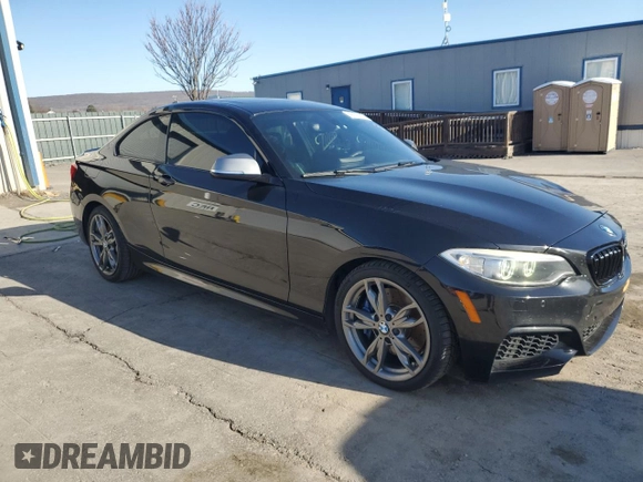 2015 BMW 2 Series M235i xDrive with VIN WBA1J9C58FVX98415, listed as a Copart auction lot 49793655 with 110,169 mi miles and Salvage Title. Bid and sale history available at DreamBid. Image 4.