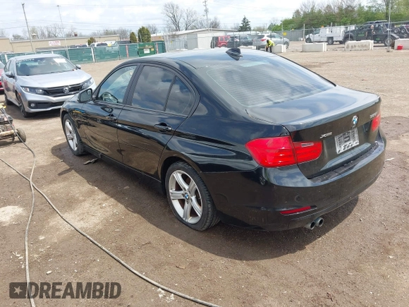 2014 BMW 3 Series 328i xDrive with VIN WBA3B3C58EJ982424, listed as a IAAI auction lot 42075568 with 190,009 mi miles. Bid and sale history available at carsss.com. Image 3.