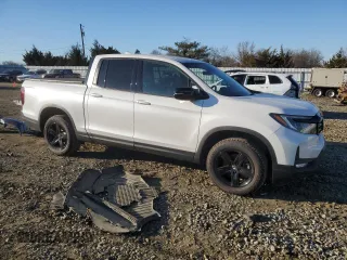 2023 Honda Ridgeline Black Edition with VIN 5FPYK3F82PB055208, listed as a Copart auction lot 87029914 with 33,687 mi miles and Salvage title. Bid and sale history available at DreamBid. Image 4.