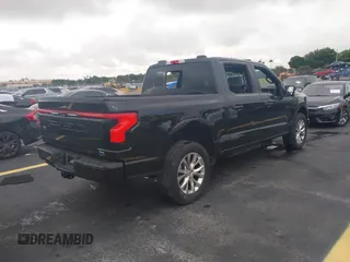 2023 Ford F-150 Lightning Pro with VIN 1FT6W1EV3PWG08587, listed as a IAAI auction lot 42418036 with Not provided miles and . Bid and sale history available at DreamBid. Image 4.