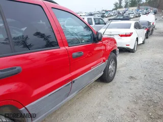 1999 Jeep Grand Cherokee Laredo with VIN 1J4GW58S0XC519908, listed as a IAAI auction lot 41789905 with 221,064 mi miles. Bid and sale history available at carsss.com. Image 12.