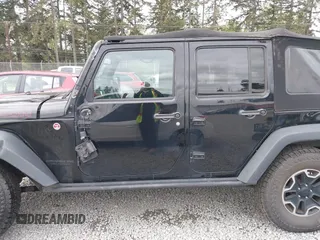 2015 Jeep Wrangler Unlimited Rubicon Hard Rock with VIN 1C4HJWFG6FL757421, listed as a IAAI auction lot 42107514 with 63,997 mi miles and . Bid and sale history available at DreamBid. Image 15.