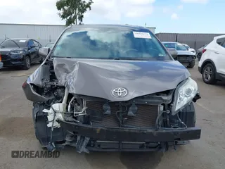 2014 Toyota Sienna XLE with VIN 5TDYK3DC7ES517206, listed as a IAAI auction lot 41945572 with 128,743 mi miles and . Bid and sale history available at DreamBid. Image 13.