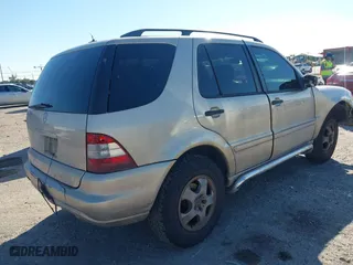 2003 Mercedes-Benz M-Class 3.7L with VIN 4JGAB57E23A453057, listed as a IAAI auction lot 41704721 with 190,649 mi miles. Bid and sale history available at carsss.com. Image 4.