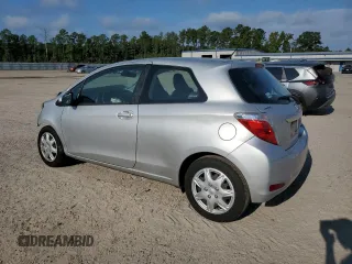 2014 Toyota Yaris L with VIN VNKJTUD30EA006137, listed as a Copart auction lot 72061304 with 104,664 mi miles and Salvage Title. Bid and sale history available at carsss.com. Image 2.