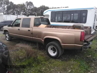 1996 GMC Sierra 1500 with VIN 1GTHC33J4TF010466, listed as a Copart auction lot 48392195 with 143,267 mi miles and Salvage Title. Bid and sale history available at DreamBid. Image 2.