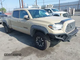 2020 Toyota Tacoma SR5 with VIN 5TFDZ5BN7LX052976, listed as a IAAI auction lot 42626487 with 80,641 mi miles and . Bid and sale history available at DreamBid. Image 1.