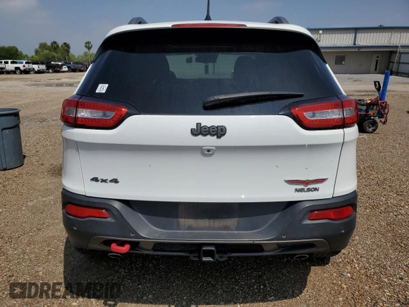 2014 Jeep Cherokee Trailhawk with VIN 1C4PJMBS9EW140344, listed as a Copart auction lot 50579005 with 117,326 mi miles and Salvage Title. Bid and sale history available at carsss.com. Image 6.
