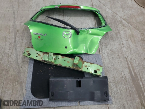 2012 Mazda 2 Sport with VIN JM1DE1KY9C0151578, listed as a Copart auction lot 52625055 with 123,812 mi miles and Salvage Title. Bid and sale history available at DreamBid. Image 12.