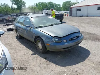 1999 Ford Taurus SE z VIN 1FAFP58SXXA242975, wystawiony jako IAAI lot #42253538 z przebiegiem 228 824 mil mil oraz . Historia ofert i sprzedaży dostępna na DreamBid. Obrazek 1.