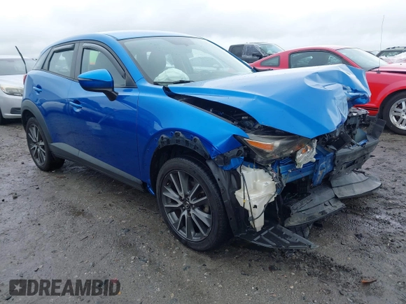 2017 Mazda CX-3 Touring z VIN JM1DKFC7XH0171860, wystawiony jako IAAI lot #42249818 z przebiegiem 54 873 mil mil oraz . Historia ofert i sprzedaży dostępna na DreamBid. Obrazek 1.