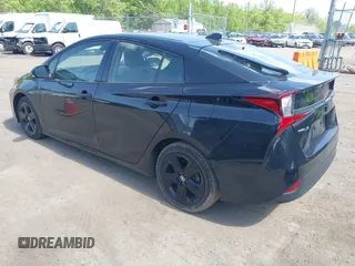 2022 Toyota Prius L Eco with VIN JTDKAMFU0N3175619, listed as a IAAI auction lot 42098135 with 72,984 mi miles and . Bid and sale history available at DreamBid. Image 3.