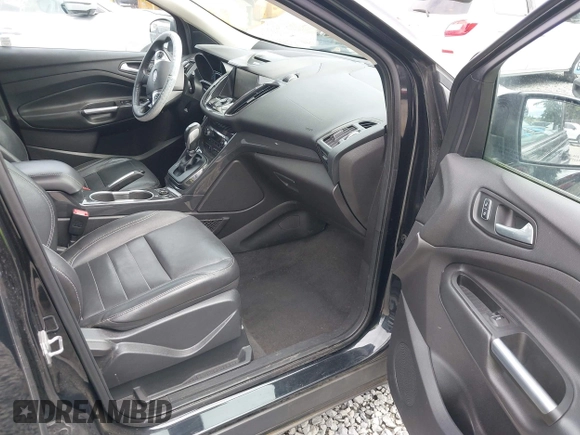 2014 Ford Escape Titanium with VIN 1FMCU9J95EUD60587, listed as a IAAI auction lot 42129854 with 155,559 mi miles and . Bid and sale history available at DreamBid. Image 5.