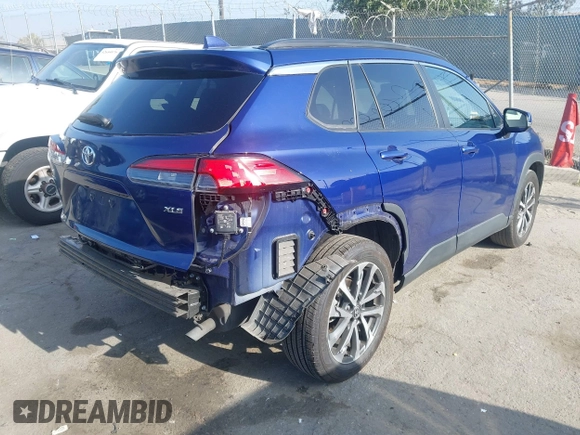 2022 Toyota Corolla Cross XLE with VIN 7MUDAAAG7NV024323, listed as a IAAI auction lot 42643048 with 76,465 mi miles and . Bid and sale history available at DreamBid. Image 4.