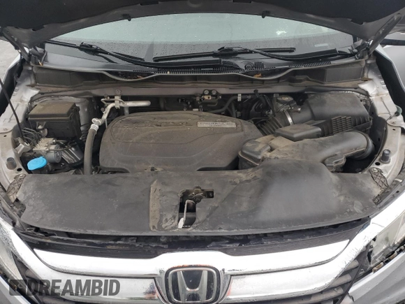 2018 Honda Odyssey EX-L z VIN 5FNRL6H74JB033475, wystawiony jako Copart lot #55736415 z przebiegiem 104 108 mil mil oraz Szkoda całkowita • Salvage title. Historia ofert i sprzedaży dostępna na DreamBid. Obrazek 12.