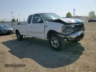 2002 Ford F-150 XL z VIN 1FTRX18LX2NA09494, wystawiony jako Copart lot #55255925 z przebiegiem 331 667 mil mil oraz Szkoda całkowita • Salvage title. Historia ofert i sprzedaży dostępna na DreamBid. Obrazek 13.