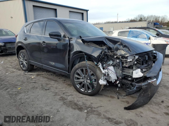 2024 Mazda CX-5 2.5 Turbo Signature with VIN JM3KFBXY7R0515256, listed as a Copart auction lot 87404694 with 4,699 mi miles and Salvage Title. Bid and sale history available at carsss.com. Image 4.