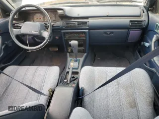 1991 Toyota Camry z VIN 4T1SV24E5MU355011, wystawiony jako Copart lot #51021185 z przebiegiem 135 881 mil mil oraz Czysty tytuł • Clean title. Historia ofert i sprzedaży dostępna na DreamBid. Obrazek 8.