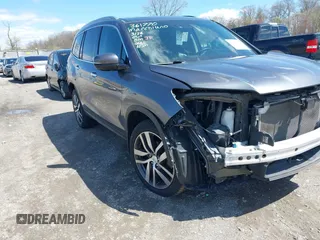 2016 Honda Pilot Elite with VIN 5FNYF6H06GB058392, listed as a IAAI auction lot 41983804 with 103,304 mi miles. Bid and sale history available at carsss.com. Image 1.