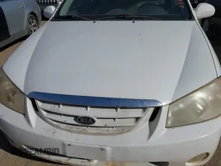 2004 Kia Spectra LX with VIN KNAFE121745036331, listed as a IAAI auction lot 41735613 with 67,634 mi miles. Bid and sale history available at carsss.com. Image 10.