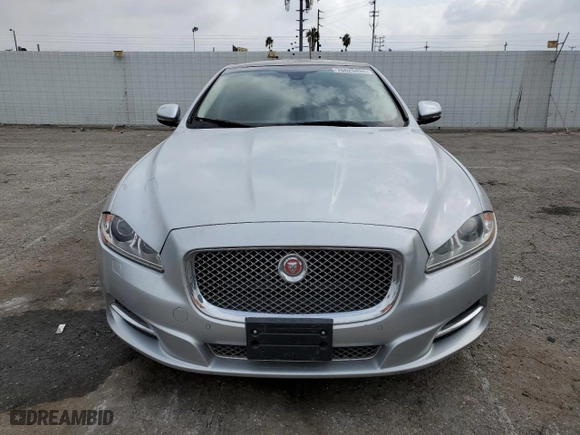 2014 Jaguar XJ with VIN SAJWJ2GD2E8V62696, listed as a Copart auction lot 76620494 with 85,487 mi miles and Salvage Title. Bid and sale history available at carsss.com. Image 5.