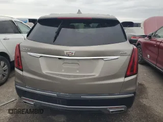 2022 Cadillac XT5 FWD Premium Luxury z VIN 1GYKNCRS1NZ126722, wystawiony jako Copart lot #87977755 z przebiegiem Nie podano mil oraz Nie do naprawy • Non repairable. Historia ofert i sprzedaży dostępna na DreamBid. Obrazek 6.