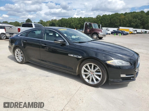2018 Jaguar XJ with VIN SAJWA1C76J8W14271, listed as a Copart auction lot 73777914 with 124,155 mi miles and Salvage Title. Bid and sale history available at carsss.com. Image 4.