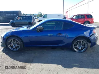 2013 Scion FR-S with VIN JF1ZNAA11D2702415, listed as a IAAI auction lot 40381041 with 63,581 mi miles. Bid and sale history available at carsss.com. Image 14.